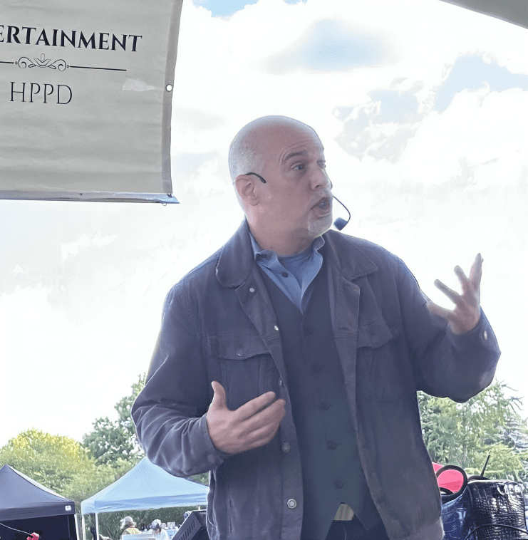 Man speaking at outdoor event